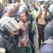 Commercial taxi driver Francis Nana escorted by police officers at the Monrovia City Court after being charged with murder for the death of LNP Patrolman Mark Bracewell at the Gabriel Tucker Bridge in Monrovia
