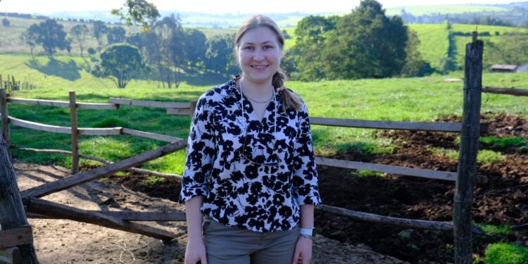 Ruth O’Reilly, Technical Marketing Manager at Alltech, stands on a Kenyan farm during the IFAJ-Alltech Boot Camp, discussing sustainable agriculture and innovation