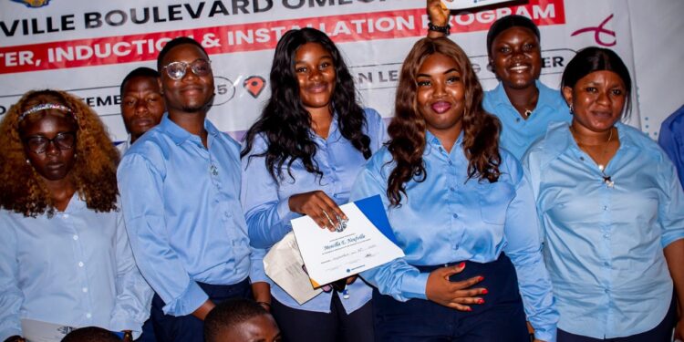 Members of the newly inducted Paynesville Boulevard Omega LEOs Club pose with certificates during their leadership installation ceremony in Paynesville.