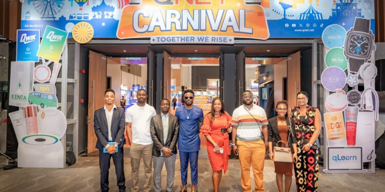 QNET executives and global distributors pose at the entrance of the V-Malaysia 2025 Carnival during the company’s 27th-anniversary convention in Penang, Malaysia.