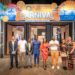 QNET executives and global distributors pose at the entrance of the V-Malaysia 2025 Carnival during the company’s 27th-anniversary convention in Penang, Malaysia.