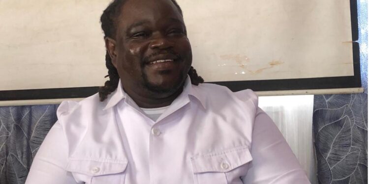 Samuel S. Dean, Executive Director of the National Commission on Disabilities, speaks at a press conference in Monrovia following the protest by visually impaired Liberians