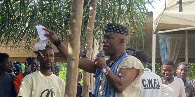 Senator Samuel Kogar addresses Nimba residents during a reconciliation meeting, urging political unity and warning against division among county leaders