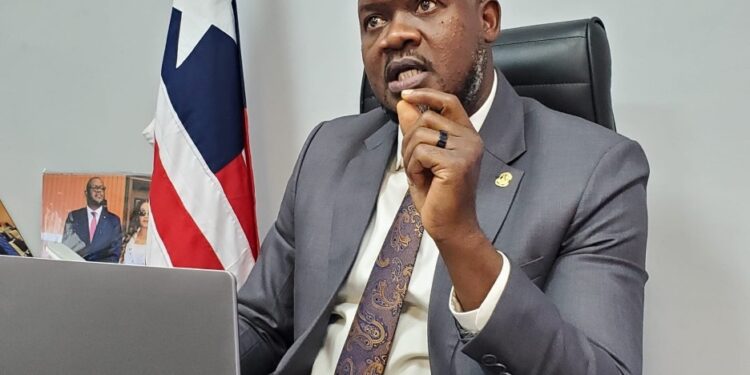 Nimba County Senator Nya D. Twayen Jr. addresses journalists on Capitol Hill, calling for transparency and community benefits in the US$37 million Ivanhoe Liberia rail-port deal