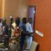 Sergeants-at-Arms escort Montserrado County District 10 Representative Yekeh Kolubah out of plenary following a heated exchange with Speaker Richard Koon at the Capitol.
