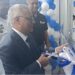 Indian Ambassador to Liberia Manoj Bihari Verma cuts the ribbon at the dedication of Bajaj Auto’s new Paynesville facility, alongside Silver Automobiles executives