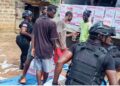 Liberia Drug Enforcement Agency officers search a businessman’s truck loaded with soap in Bernard’s Farm, Monrovia, after receiving a tip about possible narcotics