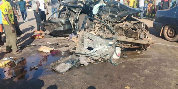 Wreckage of a taxi involved in a deadly head-on collision along the Suakoko–Monrovia Highway in Bong County that killed seven people, including a baby