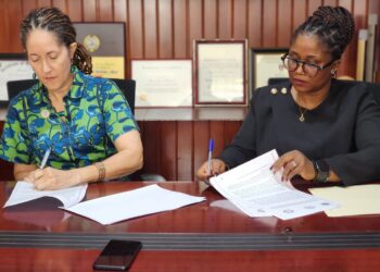 University of Liberia President Dr. Layli Maparyan and LIPO Commissioner Hon. Garmai Koboi sign the Technology and Innovation Support Center Institutional Agreement at UL campus on September 30, 2025