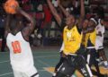 Mighty Barrolle’s forward attempts a jump shot as NPA Pythons defenders close in during their Liberia Basketball Association First Division semifinal series at SKD Gymnasium