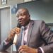 Central Bank of Liberia Executive Governor Henry Saamoi addresses a press conference in Monrovia after announcing a one-point cut in the monetary policy rate.