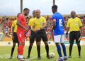 Liberia and Equatorial Guinea captains exchange flags before kickoff at the Estadio de Malabo during their final 2026 World Cup qualifying match