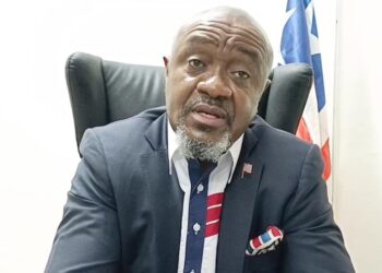 PPCC Executive Director Bodger Scott Johnson speaks during a briefing in Monrovia amid growing questions about his participation in a China trip tied to the $22M yellow machines deal.
