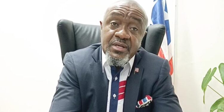 PPCC Executive Director Bodger Scott Johnson speaks during a briefing in Monrovia amid growing questions about his participation in a China trip tied to the $22M yellow machines deal.