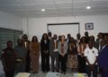 Members of Noble Second Floor and UL officials pose during the turnover of a refurbished $12,000 classroom module at the Louis Arthur Grimes School of Law in Monrovia