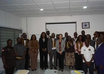Members of Noble Second Floor and UL officials pose during the turnover of a refurbished $12,000 classroom module at the Louis Arthur Grimes School of Law in Monrovia
