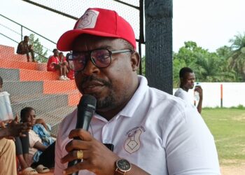 Liberia Kickball Federation President Emmanuel Surprise Whea and Youth and Sports Minister Jeror Cole Bangalu discuss the canceled trip to Sierra Leone due to lack of funding
