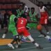 Oilers guard drives past Pythons defenders during Game 1 of the Liberia Basketball Association First Division Finals