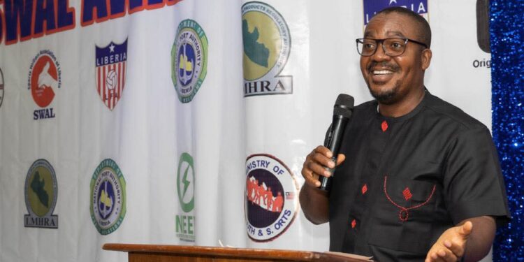 Dr. Thomas Nimene Tweh Jr., founder of the Country Man Movement, addresses guests during the 2025 SWAL Awards in Monrovia after pledging support for sports journalism.