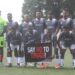 Liberian football players pose before a match holding a banner that reads “Say No to Drugs,” as the LFA launches its new anti-doping initiative