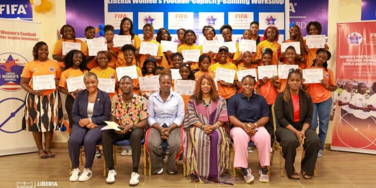 Participants of the Liberia Football Association’s Girls Guard workshop pose with certificates after completing a three-day FIFA-funded capacity-building program.