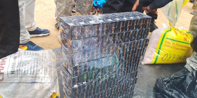 Stacks of seized Tramadol packs displayed by LDEA officers in Nimba County following a major anti-drug operation on the Yekepa-Sanniquillie highway