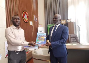 Integrity Watch Liberia Executive Director Harold Aidoo presents the 2026 Budget Option Paper to House Speaker Richard Koon at the Capitol Building in Monrovia.