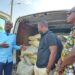 Community leaders of the New Kru Town Jamboree receive 100 bags of cement donated by U.S.-based Liberian Richard Wah Sio to support the Trowin–Mombo Bridge Project