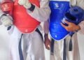Liberia’s national Taekwondo athletes Derrick T. Swaray and Moses Kollie pose after qualifying to represent Liberia at the 2025 World Taekwondo Championship in China.