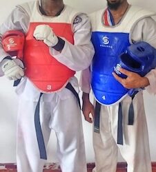 Liberia’s national Taekwondo athletes Derrick T. Swaray and Moses Kollie pose after qualifying to represent Liberia at the 2025 World Taekwondo Championship in China.