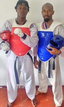 Liberia’s national Taekwondo athletes Derrick T. Swaray and Moses Kollie pose after qualifying to represent Liberia at the 2025 World Taekwondo Championship in China.