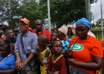 A group of disabled persons yesterday marched onto the ground of the Executive Mansion calling for the resignation of their leader