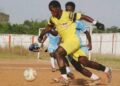 Youth football players competing during regional AML Cup district matches in Liberia