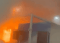 Fire trucks and smoke at COP30 venue in Belém as emergency crews respond to a fire in Zone B during the global climate conference