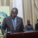 A man in a suit speaking at a podium during a regional anti-money laundering forum