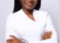 Alphia Faith Kemokai, Liberian youth advocate and Program Manager of YPLS Africa, poses in a white outfit after being selected for the Obama Foundation’s 2025 Leaders Africa Program.