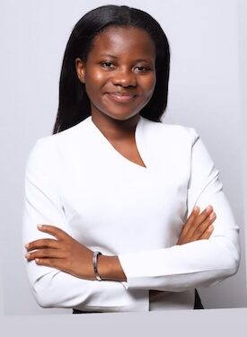 Alphia Faith Kemokai, Liberian youth advocate and Program Manager of YPLS Africa, poses in a white outfit after being selected for the Obama Foundation’s 2025 Leaders Africa Program.