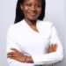 Alphia Faith Kemokai, Liberian youth advocate and Program Manager of YPLS Africa, poses in a white outfit after being selected for the Obama Foundation’s 2025 Leaders Africa Program.