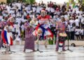 Traditional Liberian performers showcasing cultural heritage during a public celebration