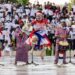 Traditional Liberian performers showcasing cultural heritage during a public celebration
