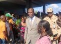 Nelsco Aleo Wolo walks among supporters after Senate confirmation as LIS Deputy Commissioner