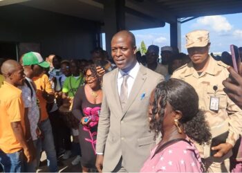 Nelsco Aleo Wolo walks among supporters after Senate confirmation as LIS Deputy Commissioner