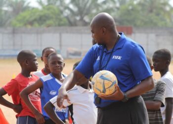 FIFA Talent Coach Ammy Ninje instructs young Liberian footballers during a youth training session in Monrovia