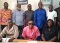A group photo of officials from the Peacebuilding Office and the Community Watch Forum after signing an MOU to enhance Liberia’s early-warning and community-security cooperation.