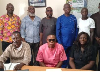 A group photo of officials from the Peacebuilding Office and the Community Watch Forum after signing an MOU to enhance Liberia’s early-warning and community-security cooperation.