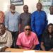 A group photo of officials from the Peacebuilding Office and the Community Watch Forum after signing an MOU to enhance Liberia’s early-warning and community-security cooperation.