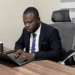William Telebo Thompson working on a laptop after being appointed Global President of the International Chess Polytechnic