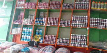 Shelves of seeds, farm chemicals, and feed supplies displayed at Agro Power’s new outlet in Kakata.