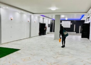 Renovated DILISS auditorium redesigned by Bestman Consult, featuring modern lighting and architectural finishes
