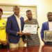 LFA President Mustapha Raji receives honor from Roberts Sports Academy for supporting grassroots football in Liberia.